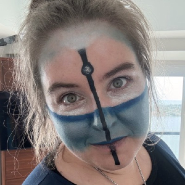 Christine in shark face paint, grinning